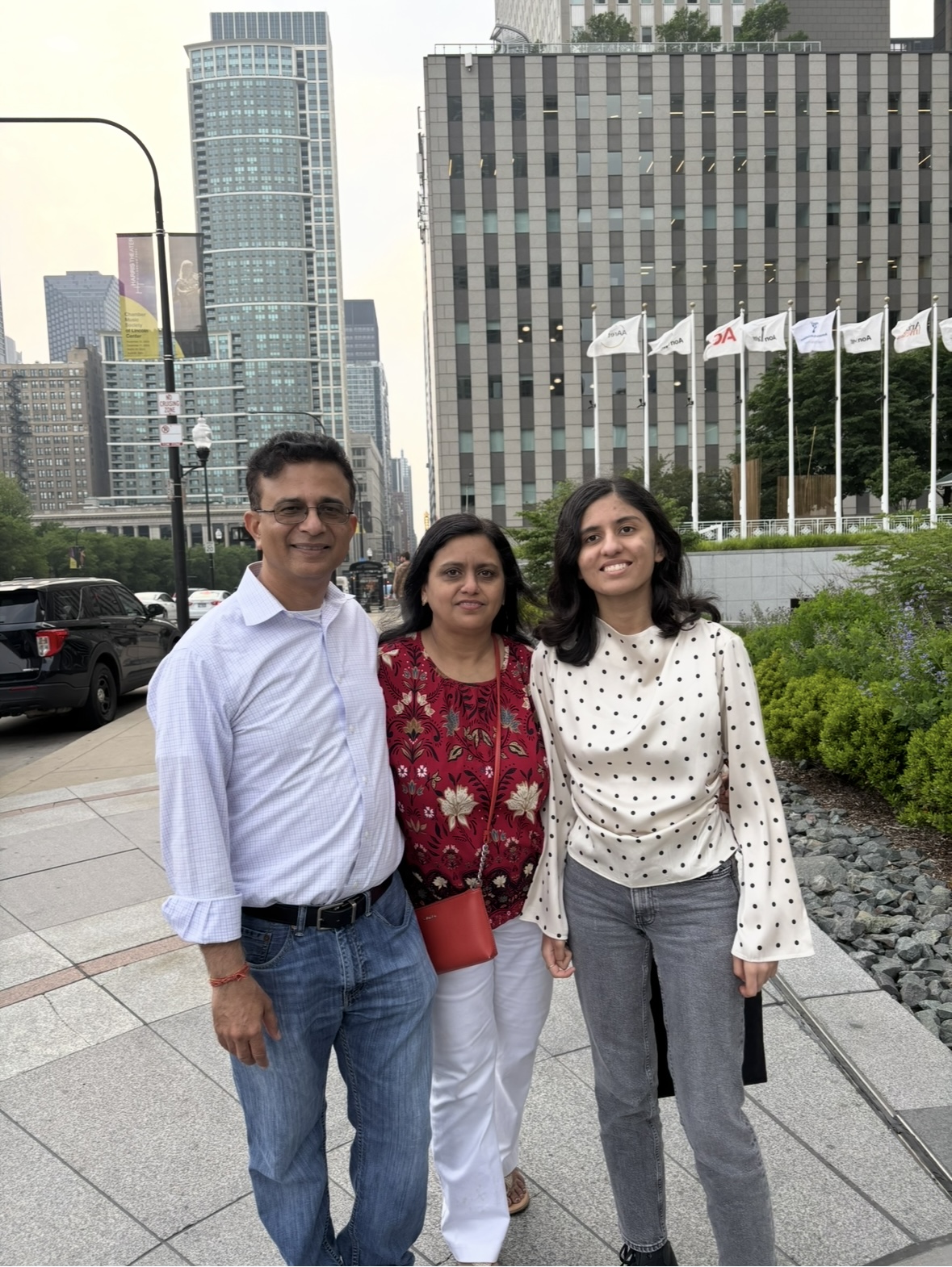 father and daughter business partners high fiving in a bright modern office, casual professional attire, warm lighting, candid moment